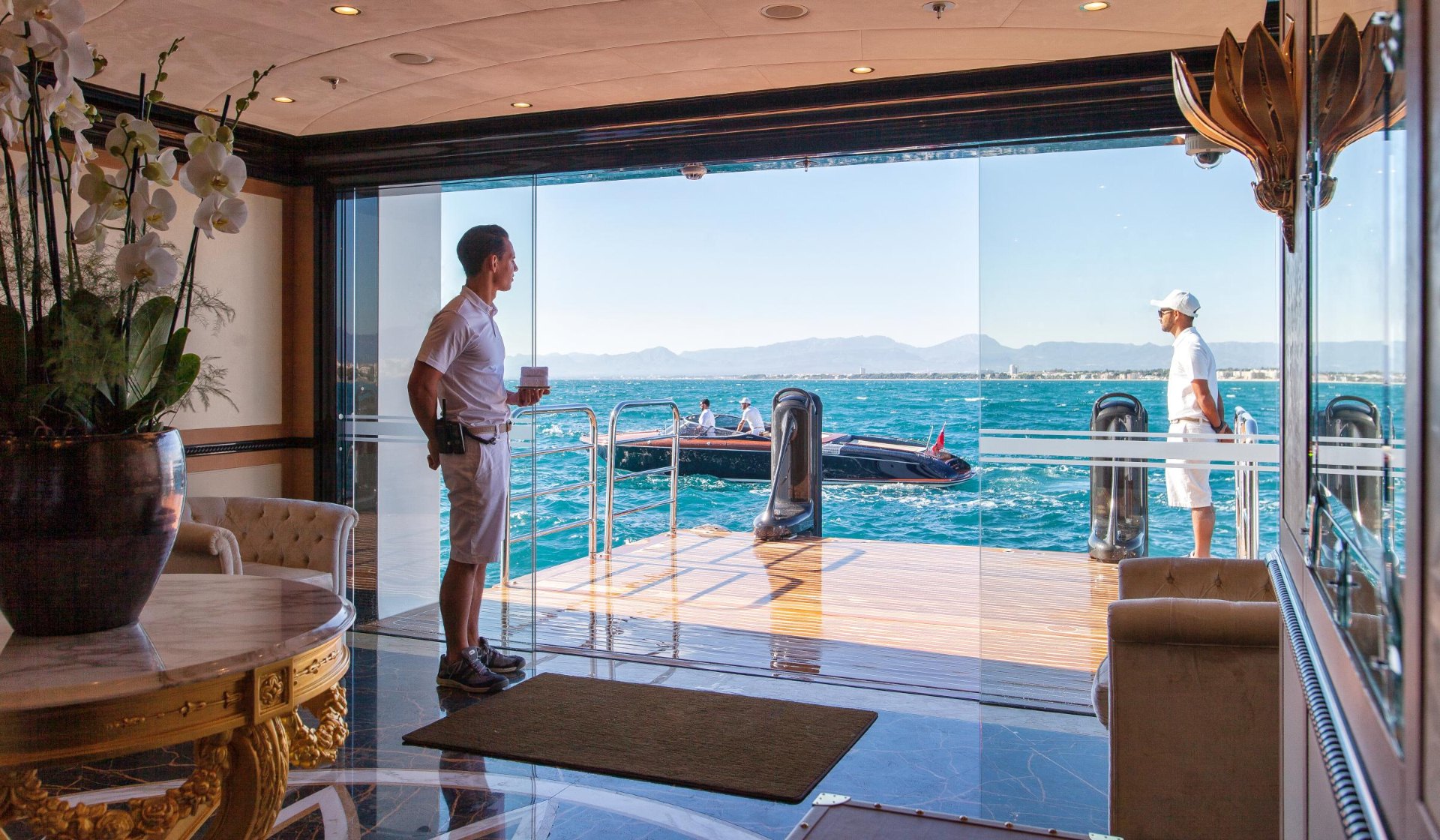 Tender being launched from a superyacht beach club